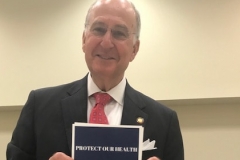 Photo Dana Sargent: Delivering CWM Postcards to Rep. Ted Davis at the House Select Committee on River Water Quality, Raleigh, April 26, 2018